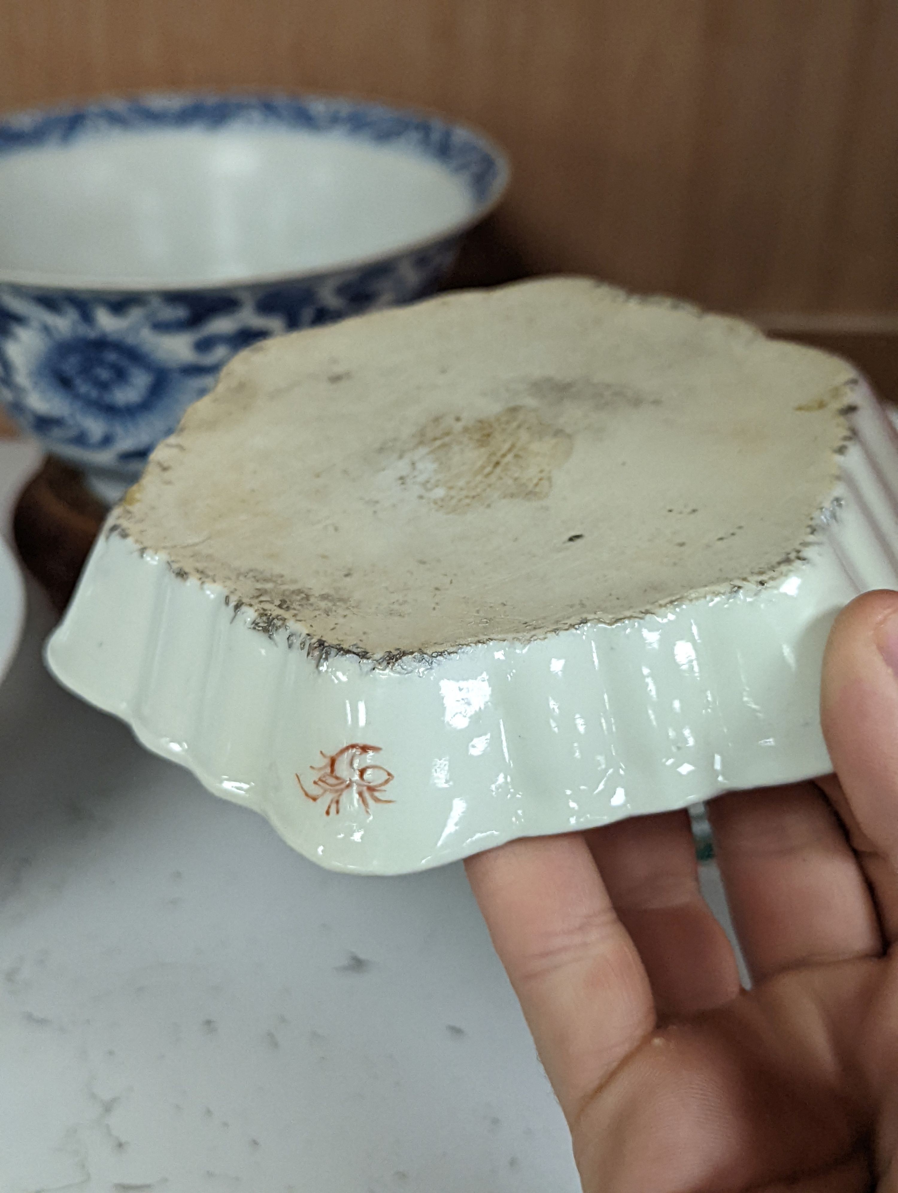 A Chinese blue and white bowl, Kangxi, 15cm. diam., a famille rose teapot stand, Yongzheng, and two doucai bowls